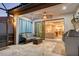 Covered patio with seating area and view into the living room at 8744 Bellussi Dr, Sarasota, FL 34238