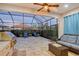 Covered patio with outdoor kitchen, seating area, and grill at 8744 Bellussi Dr, Sarasota, FL 34238