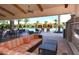 Resort-style pool area with covered seating and a fireplace at 8744 Bellussi Dr, Sarasota, FL 34238