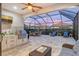 Outdoor kitchen with grill and TV, near patio at 8744 Bellussi Dr, Sarasota, FL 34238