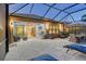 Spacious outdoor living area with seating and grill at 8744 Bellussi Dr, Sarasota, FL 34238