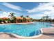 Resort-style swimming pool with cabanas and lounge chairs at 8744 Bellussi Dr, Sarasota, FL 34238