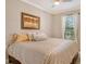 Guest bedroom with king-size bed and neutral decor at 8744 Bellussi Dr, Sarasota, FL 34238