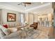 Bright and airy living room with ample natural light and comfortable seating at 8744 Bellussi Dr, Sarasota, FL 34238