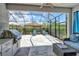 Outdoor kitchen with stainless steel grill and granite countertops at 8744 Bellussi Dr, Sarasota, FL 34238