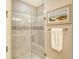 Large walk-in shower with marble tile and built-in seat at 8744 Bellussi Dr, Sarasota, FL 34238