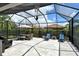 Spacious covered patio with seating and dining areas at 8744 Bellussi Dr, Sarasota, FL 34238