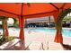 View of the refreshing pool and relaxing cabanas at 8744 Bellussi Dr, Sarasota, FL 34238