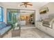 Outdoor kitchen with a built-in grill and sliding glass doors leading to the interior at 8744 Bellussi Dr, Sarasota, FL 34238