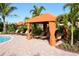 Relax in the shade at poolside cabanas with lounge chairs at 8744 Bellussi Dr, Sarasota, FL 34238