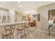 Kitchen boasts granite countertops, stainless steel appliances, and a breakfast bar at 8744 Bellussi Dr, Sarasota, FL 34238