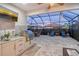 Outdoor kitchen and entertainment area with patio at 8744 Bellussi Dr, Sarasota, FL 34238