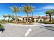 Exterior view of the community clubhouse at 8744 Bellussi Dr, Sarasota, FL 34238