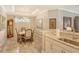 Elegant dining room with a wooden table and six chairs, hardwood floors at 8744 Bellussi Dr, Sarasota, FL 34238