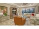 Spacious living room with a comfortable sectional sofa, large TV, and plenty of natural light at 8744 Bellussi Dr, Sarasota, FL 34238