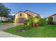 Attractive single-story home with landscaping and two-car garage at 8744 Bellussi Dr, Sarasota, FL 34238