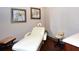 Relaxing spa treatment room with massage table and comfortable seating at 8744 Bellussi Dr, Sarasota, FL 34238