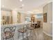 Kitchen with granite countertops, stainless steel appliances, and a breakfast bar at 8744 Bellussi Dr, Sarasota, FL 34238