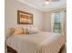 Spacious primary bedroom with plush bedding and large window at 8744 Bellussi Dr, Sarasota, FL 34238