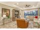 Spacious living room with a comfortable sectional sofa, large TV, and plenty of natural light at 8744 Bellussi Dr, Sarasota, FL 34238