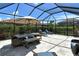 Covered patio with outdoor dining and lounge furniture at 8744 Bellussi Dr, Sarasota, FL 34238