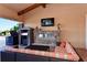 Relaxing poolside patio with fireplace and comfortable seating at 8744 Bellussi Dr, Sarasota, FL 34238