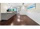 Spacious dining area with hardwood floors and modern lighting at 6401 36Th W Ave, Bradenton, FL 34209