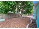 Charming backyard with a large mango tree and stone patio at 6401 36Th W Ave, Bradenton, FL 34209