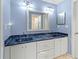 Modern bathroom with double vanity and dark countertops at 6401 36Th W Ave, Bradenton, FL 34209