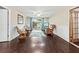 Cozy Gathering room featuring hardwood floors, wicker chairs, and sliding glass doors at 6401 36Th W Ave, Bradenton, FL 34209