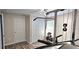 Bedroom with home gym equipment and wood floors at 6401 36Th W Ave, Bradenton, FL 34209