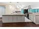 Modern kitchen with granite countertops, gray cabinets, and stainless steel appliances at 6401 36Th W Ave, Bradenton, FL 34209