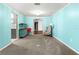 Bright den with light blue walls, grey carpet, and built-in shelving at 6401 36Th W Ave, Bradenton, FL 34209