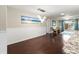 Bright dining room with hardwood floors and a beach-themed painting at 6401 36Th W Ave, Bradenton, FL 34209