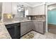 Modern kitchen features gray cabinets and granite countertops at 6401 36Th W Ave, Bradenton, FL 34209