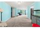 Spacious living room features light blue walls, grey carpet, and a large window at 6401 36Th W Ave, Bradenton, FL 34209