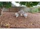 Relaxing backyard patio with stone table and benches under a tree at 6401 36Th W Ave, Bradenton, FL 34209