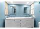 Bright bathroom with double vanity and white cabinets at 6401 36Th W Ave, Bradenton, FL 34209