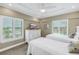 Bright bedroom with twin beds, dresser, and ocean views at 6142 Midnight Pass Rd # 14N, Sarasota, FL 34242