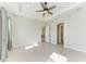 Bright bedroom with tile floors, ceiling fan and access to bath at 12734 Rainwashed Loop, Parrish, FL 34219
