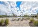 Community pool with lounge chairs and a waterslide at 12734 Rainwashed Loop, Parrish, FL 34219