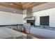 Outdoor kitchen with stainless steel appliances and granite countertops at 12734 Rainwashed Loop, Parrish, FL 34219