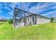 Home exterior showcasing a large backyard and pool area at 12734 Rainwashed Loop, Parrish, FL 34219