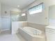 Relaxing bathroom with a garden tub and a separate walk-in shower at 12734 Rainwashed Loop, Parrish, FL 34219