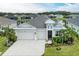 Aerial view of a home showcasing the house and surrounding landscape at 12734 Rainwashed Loop, Parrish, FL 34219