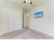 Spacious bedroom with double-door closet and neutral carpeting at 12734 Rainwashed Loop, Parrish, FL 34219