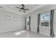 Bright and airy bedroom with tile floors and ceiling fan at 12734 Rainwashed Loop, Parrish, FL 34219