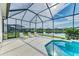 Relaxing screened patio with pool and lake view at 12734 Rainwashed Loop, Parrish, FL 34219