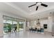 Modern kitchen with white cabinets, a blue island, and stainless steel appliances at 12734 Rainwashed Loop, Parrish, FL 34219