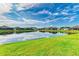 Scenic view of a tranquil lake and community homes at 12734 Rainwashed Loop, Parrish, FL 34219